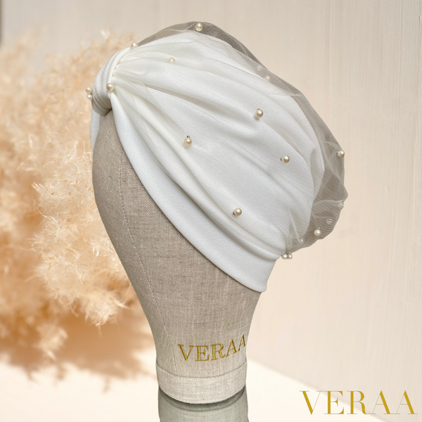 White tulle turban with champagne pearls